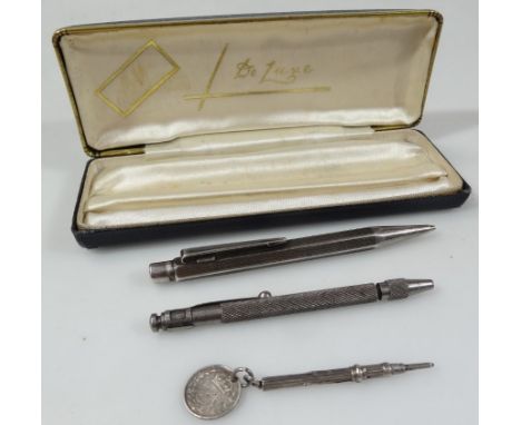 A late 19thC propelling pencil, of small proportion, 6cm wide, unmarked, attached to a Victorian 1887 3d bit, an engine turne