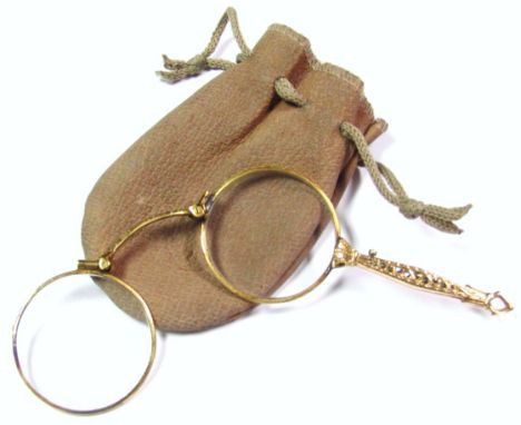 A gilt metal magnifying lorgnette, with marcasite set handle. (AF)