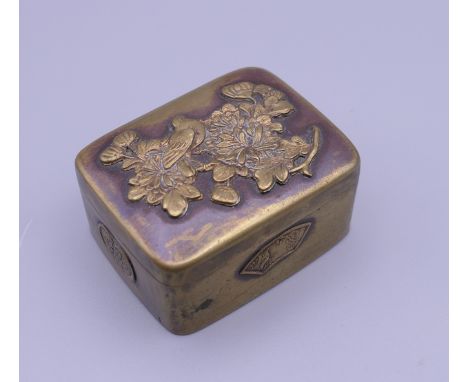 A Japanese Meiji period brass snuff box. 5 cm wide.