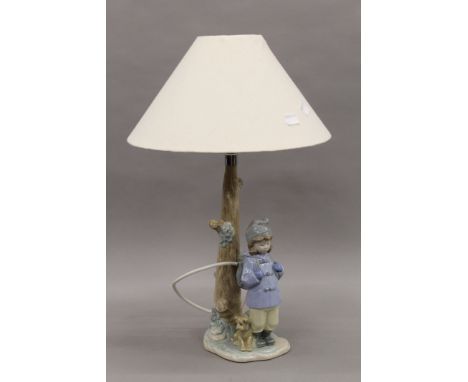 A Lladro table lamp. 47 cm high including shade.