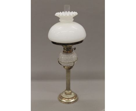 A Victorian silver plated oil lamp. 53 cm high overall.