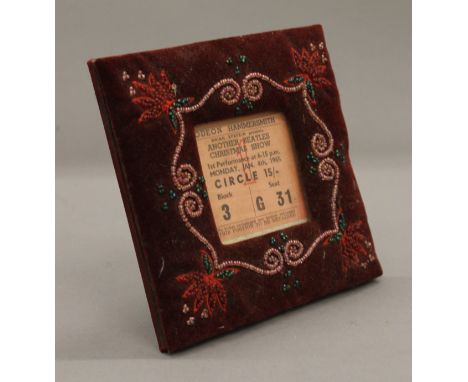 A framed ticket stub for Another Beatles Christmas Show at The Odeon Hammersmith, dated Monday Jan 4th 1965. 6.5 x 6.5 cm.