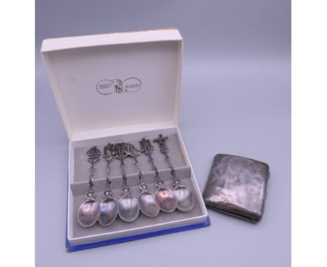 A silver cigarette case and a boxed set of white metal teaspoons.  The former 7 cm wide. The former 62.4 grammes total weight