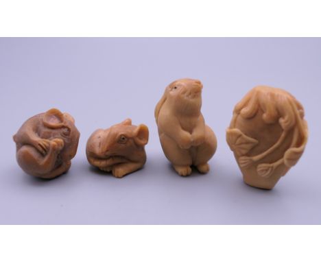 Four carved bone netsuke. The largest 4 cm high.