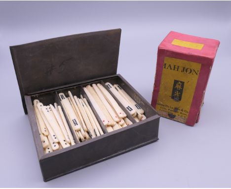 A quantity of bone hand painted Mahjong counting sticks and Thomas De La Rue Mahjong cards. (approximately 116 counting stick