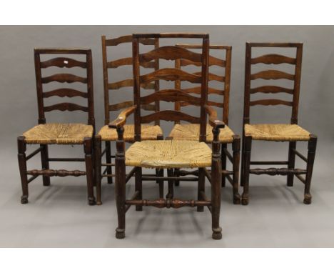 Seven various rush seated ladder back chairs.