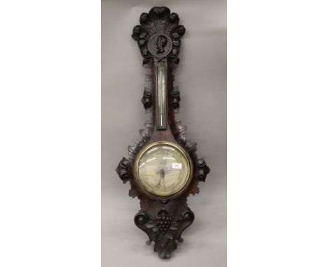 A 19th century carved oak barometer carved with a profile of The Duke of Wellington. 101 cm high.