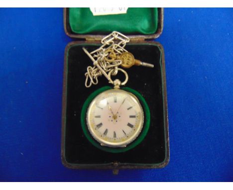 A silver pocket watch and fob with mother of pearl, enamel dial, marked 800