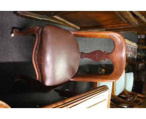 with lyre splats on serpentine seats raised on cabriole legs with ceramic castors
