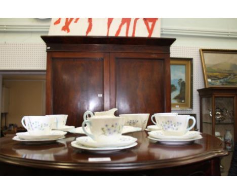comprising of cups, saucers, side plates, cream jug, sugar bowl and sandwich plate (21)