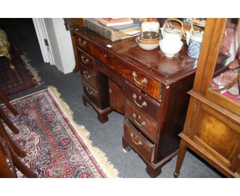 the moulded top above a long plain frieze drawer opening to reveal a fitted slope, flanked to each side by three short drawer