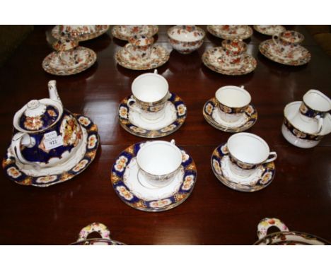 comprising of tea cups, saucers, side plates, sugar bowl, sandwich plates, cream jug