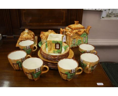 comprising of teapot, sugar bowl, cream jug, cups, saucers and a butter dish (22)