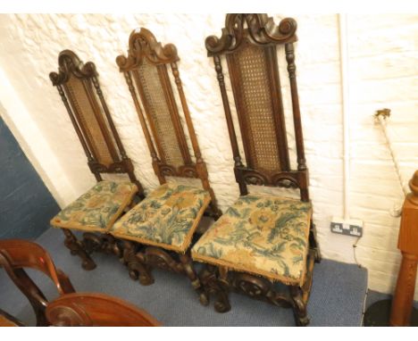 Set of five Charles II style oak framed and caned chairs with high backs, carved front legs and tapestry upholstered seats