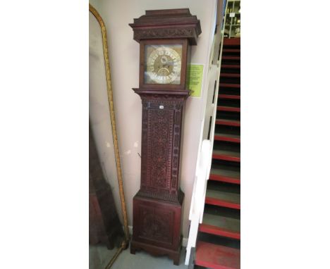 Dollif Rollison of Halton, Leeds a 19th century long case clock with brass dial over a later carved case
