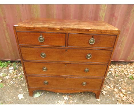 A Georgian flat fronted mahogany chest of two short and three long drawers, brass ring handles, bracket feet 41 6/8 x 42 x 19