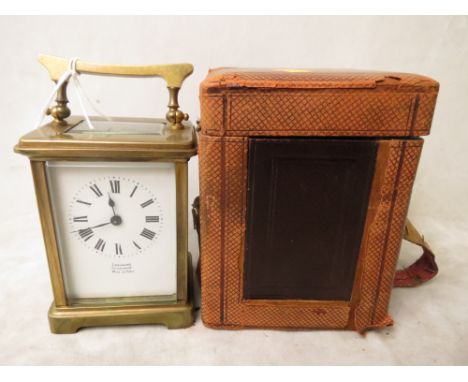 Lashmore Oswestry brass cased carriage clock, made in Paris, five windows, white enamel Roman dial with leather carrying case