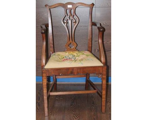 MAHOGANY CARVED HALL CHAIR
in a Chippendale style, cross stitched seat, 89cm high