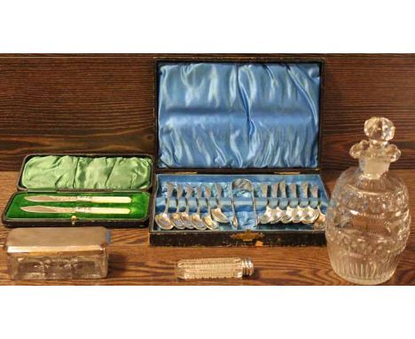 SET OF TWELVE SILVER TEASPOONS AND SUGAR TONGS IN FITTED CASE
together with silver topped hat pin dish, silver topped toilet 