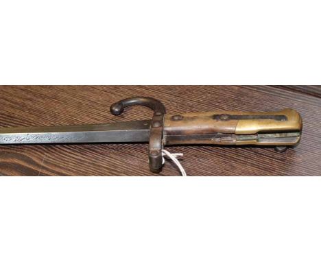 LATE NINETEENTH CENTURY BAYONET
with scabbard, note: section missing on handle