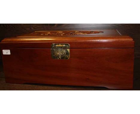 20TH CENTURY CHINESE MAHOGANY HINGED BOX
the lid is carved with bird and blossom designs, opening to reveal two vertical sect