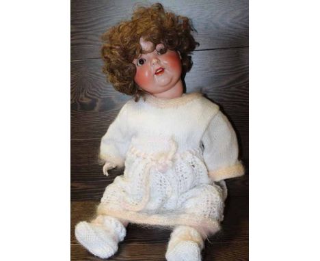 LARGE GERMAN BISQUE-HEADED DOLL
the neck with impressed mark 'Special 12', 60cm long 
Generally good condition - nail varnish