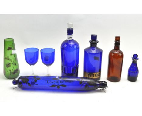 A selection of assorted coloured glassware, early 19th century and later, to include a blue blue rolling pin with remnants ol