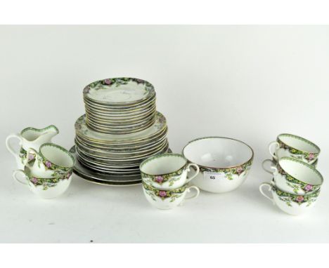 A Sutherland part tea set decorated and gilt with flowers on a black ground border to include cups, saucers, milk jug, sugar 