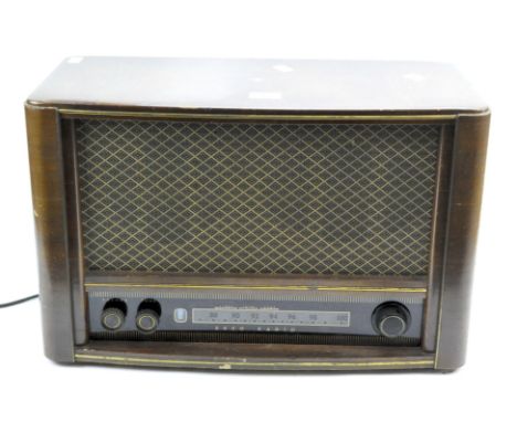 A vintage Ekco radio, model A277, within a brown wooden case, width 56cm