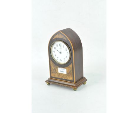 An Edwardian mantle clock, the white enamel dial with Arabic numerals with 'H. A. Wright, Sherborne' written across it, the i