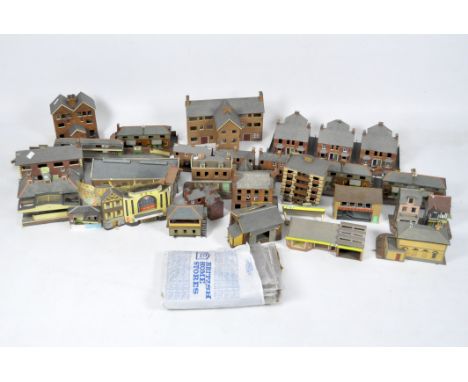 A large collection of vintage cardboard model railway houses, stations, sheds and buildings, including a collection of 'Super