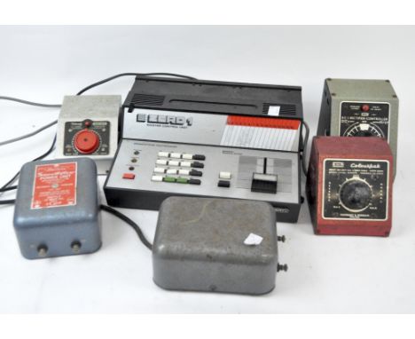 A collection of vintage railway track controls and power units, including: a Tri-ang Power unit no. 2, a Smooth How power uni