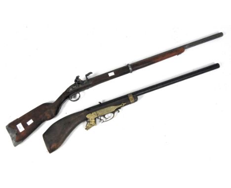 Two 20th century reproduction rifles, the first marked 'Paris' with scroll cast white metal mounts, the second with 'England 