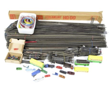 A quantity of vintage model railway track, together with a selection of related collectables, including two Corgi London Tran