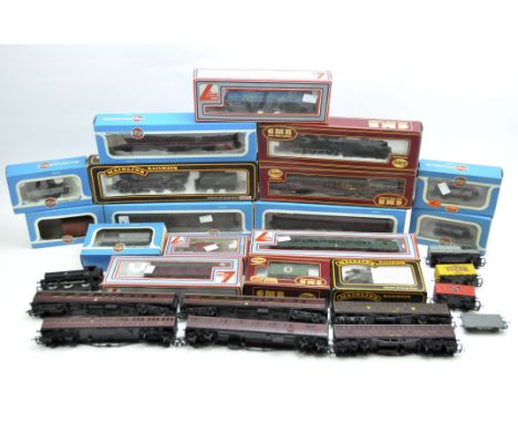 A collection of assorted OO scale locomotives and carriages, comprising examples by Airfix, Palitoy, Airfix and Lima, boxed