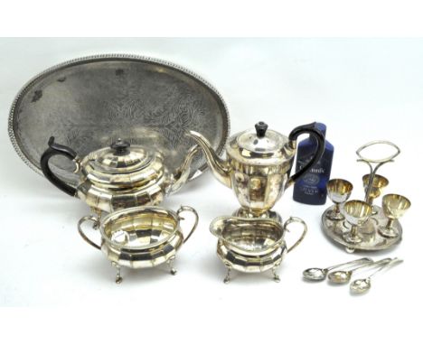 A collection of silver plated wares, including a teapot, coffee pot, sugar bowl, milk jug and egg cups on stand