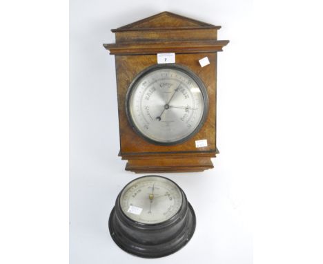 Two Negretti &amp; Zambra wall barometers, one of circular form in metal case, 27463, the other a wooden case, R/2175