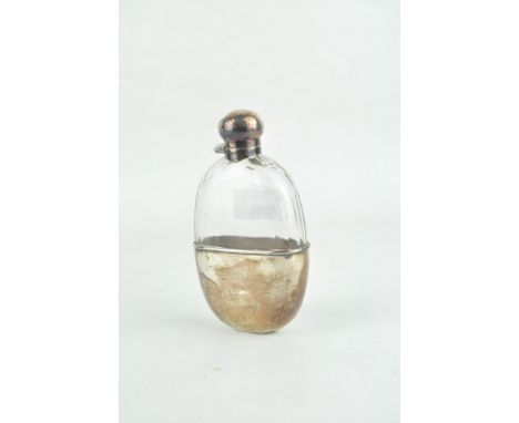 A early 20th century silver plated glass hip flask, of oval form with a hinged stopper, height 14.5cm