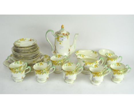 A Royal Paragon part coffee set, comprising a coffee pot, cups and saucers, cream jugs, a sugar bowl and assorted plates, all