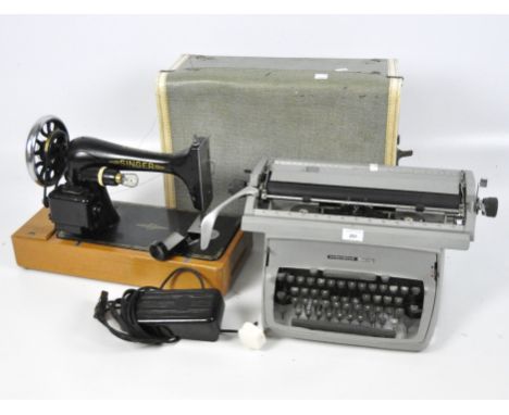 A 20th century Singer electric sewing machine and an Underwood Five vintage typewriter