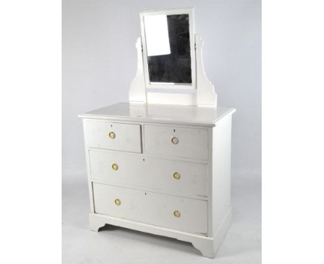 A 20th century dressing table, the rectangular top supporting a hinged mirror, beneath it is a chest of drawers with metal ri