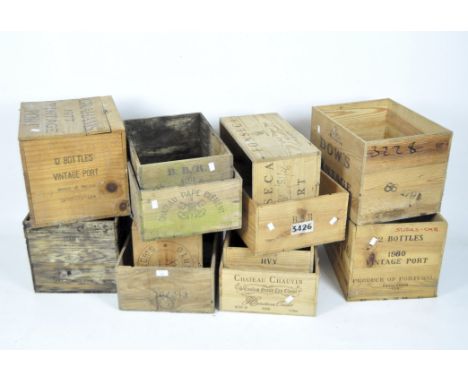 A collection of twelve vintage wooden wine crates, variously stamped for 1980 Vintage Port, Porto, Bristol, Chateau Pape Clem