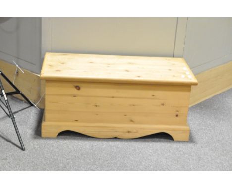 A contemporary pine blanket box with a collection of UK ordnance survey and road maps, the box on bracket feet, 40 cm high x 
