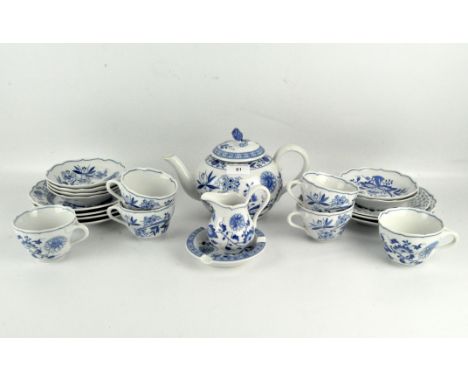 A Meissen style Hutschenreuther part tea service, all in a blue and white floral pattern, including a teapot, cups and saucer