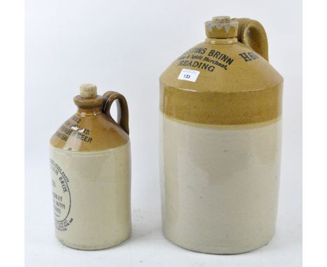 Two vintage glazed stoneware drinks flagons, one branded 'Justins Brinn, Wine and spirit merchant, Reading' the other '1932 M