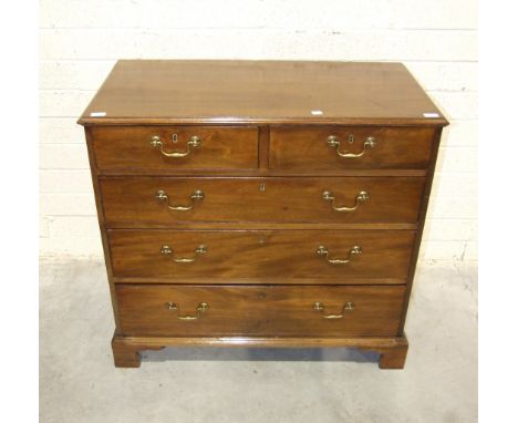 A George III mahogany rectangular chest of two short and three long drawers, on bracket feet, 99cm wide, 93cm high.
