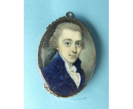 18th century English School, a miniature portrait of a gentleman wearing a blue coat and white stock, in gold jewellery clasp