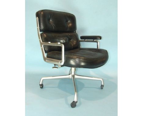A Herman Miller Time Life chair designed by Charles &amp; Ray Eames, with leather button pads and arms, supported on four-bra