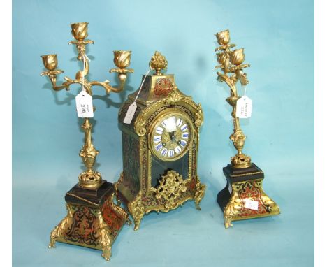 A 19th century tortoiseshell and Boulle-work mantel clock, the circular gilt dial with enamelled Roman numerals and Marti gon