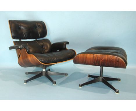 Charles &amp; Ray Eames, a lounge chair with button leather pads and arms, (two-screw fixing), with Brazilian rosewood lamina
